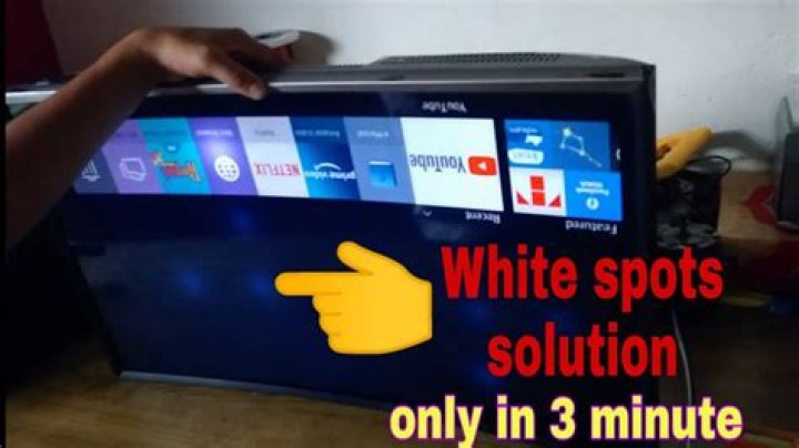 How do I fix white spots on my TV?