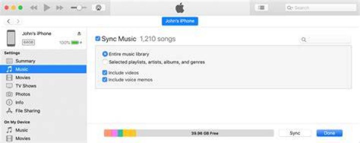 How do I manually add music to my iPhone from iTunes?