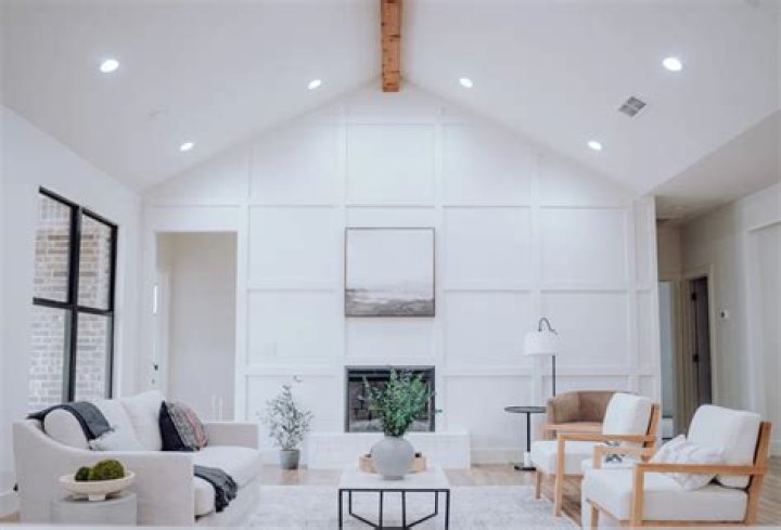 How do you style a living room with a vaulted ceiling?
