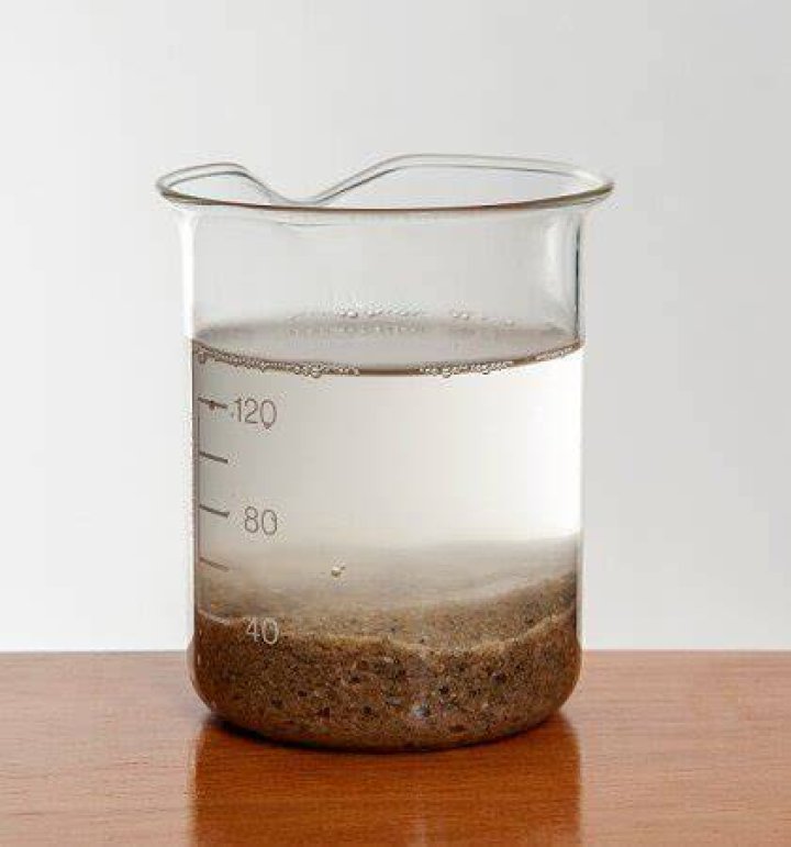 Is the mass of a cup of water greater than a cup of sand?