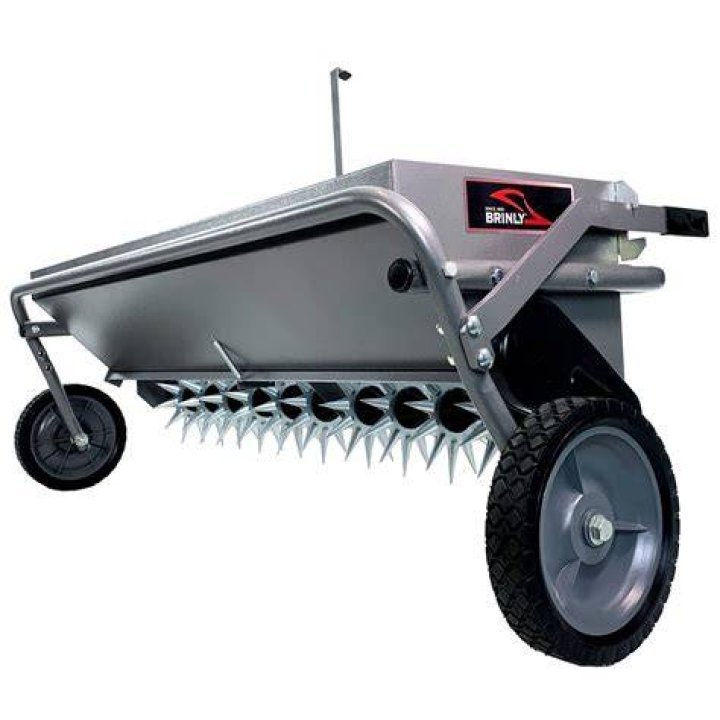 What does an aerator and spreader do?